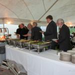 Guests serving themselves at Black & White Gala, May 2012