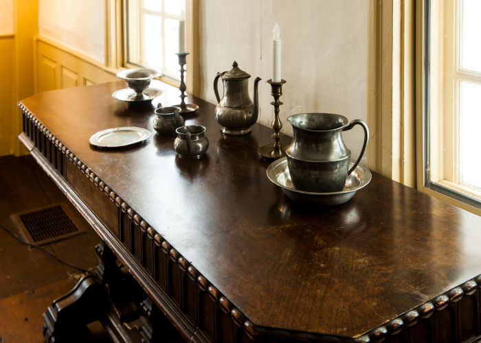 Sideboard in dining room of Dwight Derby House with pewter serving pieces.
