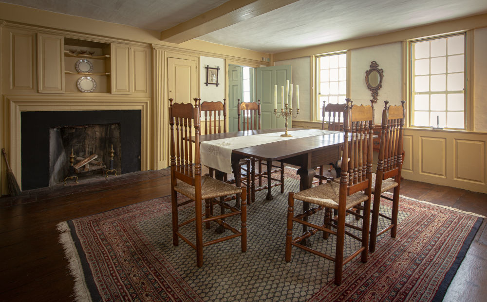 Dining room with table, chairs and rug in Dwight Derby House
