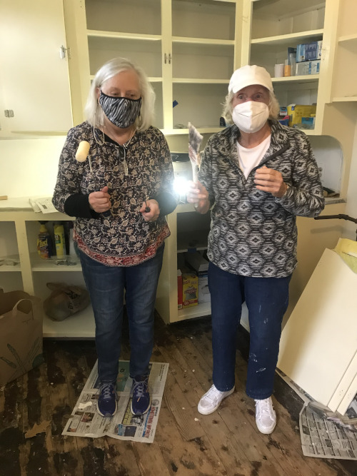 Volunteers painting kitchen at Dwight-Derby House.